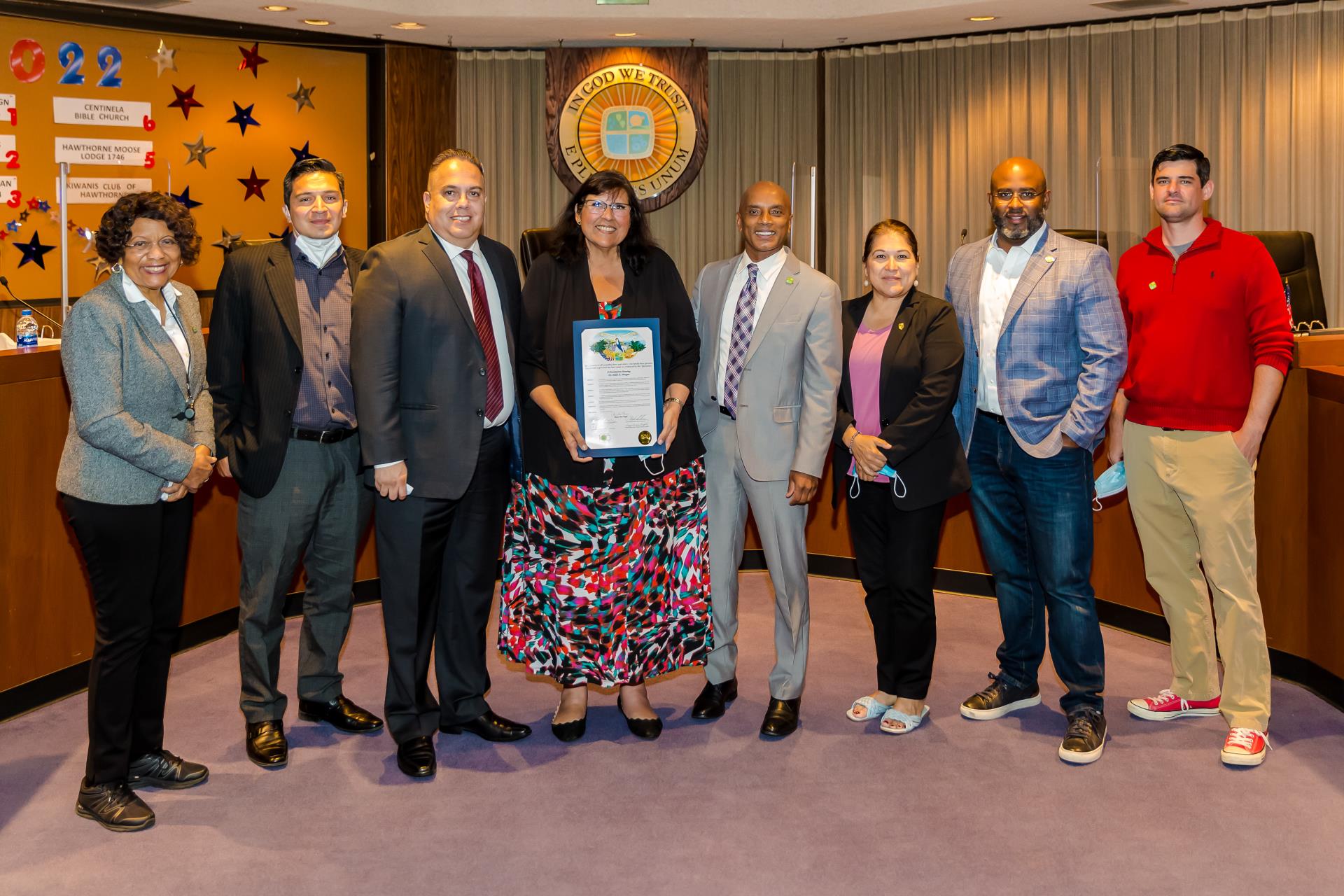 Dr. Helen E. Morgan receives a proclamation presented by City Council members