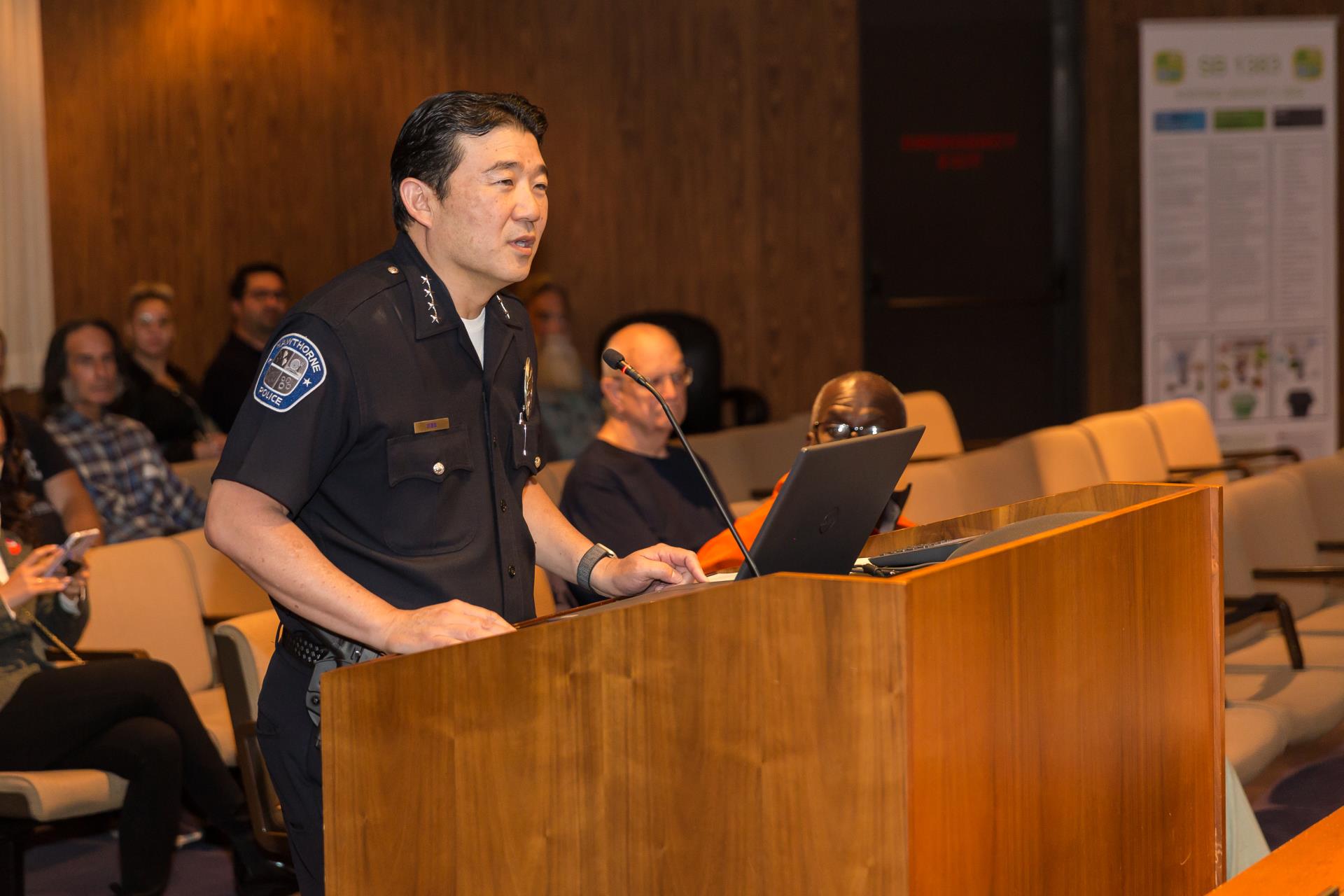 Chief Mike Ishii speaking from the podium